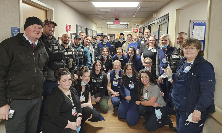 Sheriff's Office employees, led by the Deputy Sheriff's Guild, presented a letter written by Deputy Drew Kennison along with a cart of snacks and other items to say “thank you” to the Emergency Room and security staff at PeaceHealth Southwest Medical Center this week. Photo courtesy Clark County Sheriff’s Office