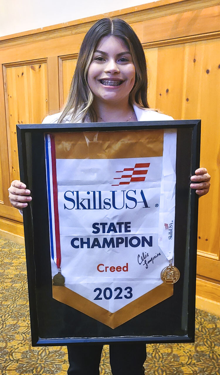 Celia Langarica, the state champion for SkillsUSA in the creed category, recited the creed in English and Spanish on Thursday at a meeting between building industry leaders and school administrators. Photo by Paul Valencia