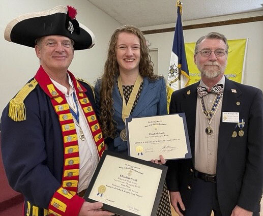Elizabeth Swift (center), a Ridgefield High School junior, has been selected as a statewide winner of two prestigious essay/oration contests sponsored by the Washington State Society of The Sons of The American Revolution. Photo courtesy Fort Vancouver SAR Chapter