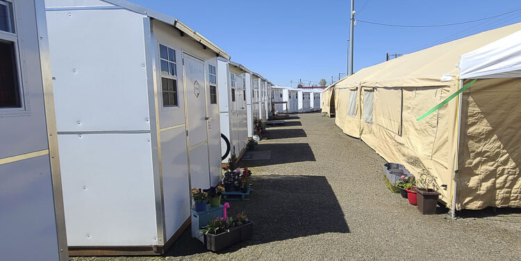 Hope Village, which has 20 units of pallet homes for temporary homes for the homeless, is celebrating a year of success stories. Photo by Paul Valencia