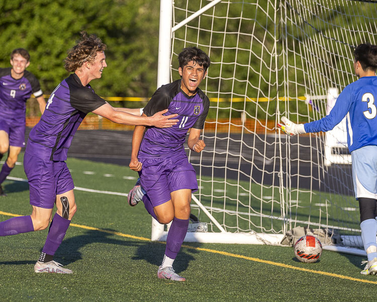 Johnpaul Guzman is all smiles after his goal Wednesday for the Columbia River Rapids. Photo by Mike Schultz