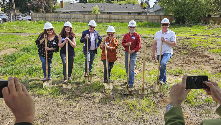 Community Roots Collaborative members break ground Wednesday on the O Street Project, the part of the project that will bring seven tiny homes to the property. Photo by Paul Valencia
