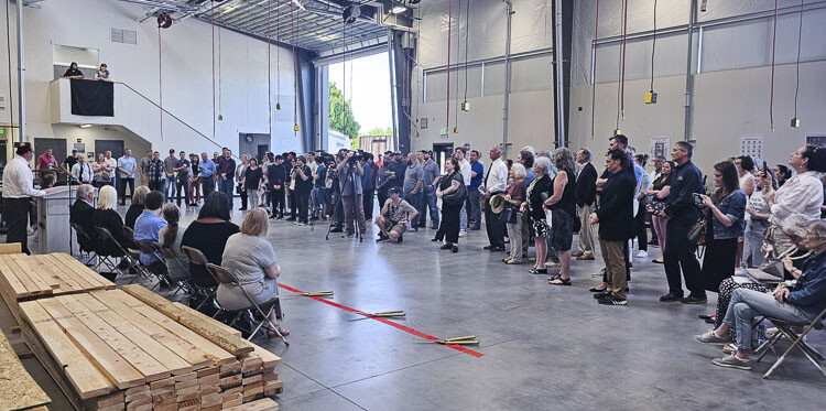 The number of people at the opening ceremony of the new Skilled Trades Center at Evergreen High School helps showcase the size of the new facility. A lot of people, but a whole lot more space for students and teachers. Photo by Paul Valencia