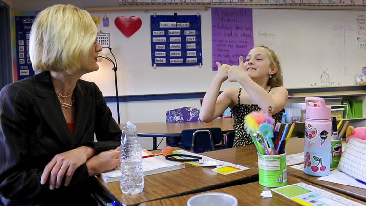 Emmalyn Pfeifer (right) gives the program a double thumbs up in conversation with Superintendent Mary Templeton (left). Photo courtesy Washougal School District