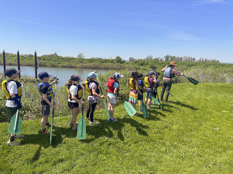 Students explored in the Columbia River in canoes fashioned to look like ones Native American tribes used. Photo courtesy Woodland School District