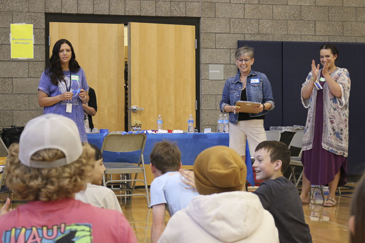 Shown here (left to right) are Lindsey Fick, Rona Ager, and Kaitlyn Huegli as they announce the science fair winners. Photo courtesy Washougal School District