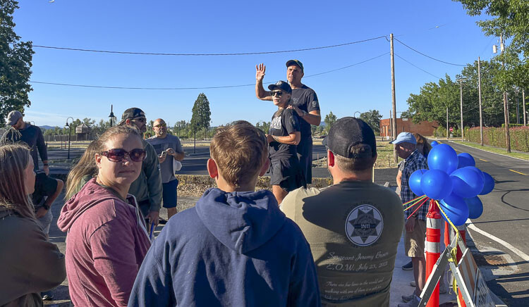 Clark County Sheriff John Horch and his wife Michelle worked beforehand to be sure the path was marked and the ribbon held high so that it would look its best when Jill and her closest family and friends walked by it. Photo courtesy Leah Anaya