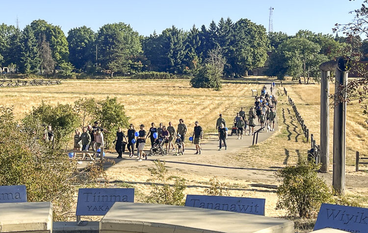 Those in attendance gathered at Fort Vancouver to start the walk and then made their way to the waterfront, where a mile-long blue ribbon was held by volunteers to mark the path. Photo courtesy Leah Anaya