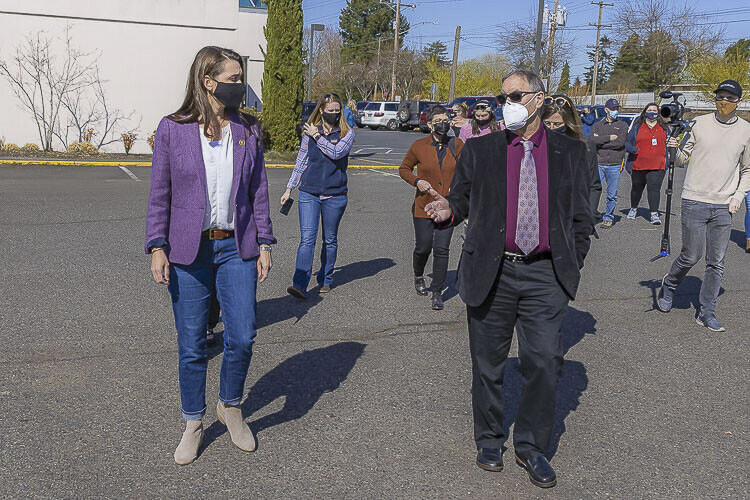 Former Congresswoman Jaime Herrera Beutler (left) and Clark County Public Health Director Dr. Alan Melnick and others wore masks during a visit last year to the Tower Mall vaccination site. File photo