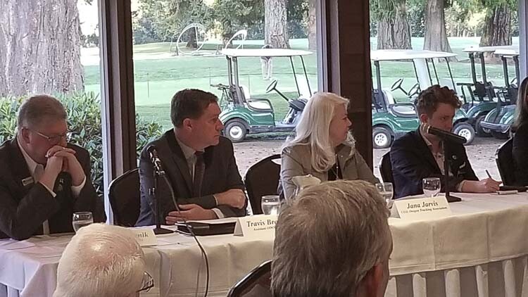 Tualatin Mayor Frank Bubenik, ODOT’s Travis Brouwer, the Oregon Trucking Association’s Jana Jarvis, and West Linn Mayor Rory Bialostosky are four of the six-member panel discussing ODOT’s plans for tolling on I-205 at a Tualatin Chamber of Commerce breakfast. Photo courtesy John Ley