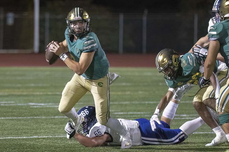 Evergreen quarterback Jayden Crace looks for an open receiver Friday against Glacier Peak. Photo by Mike Schultz