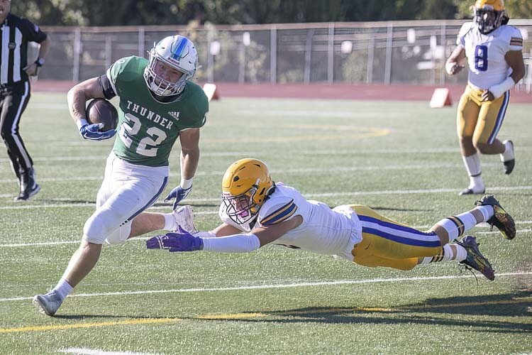 Porter Drake of Mountain View makes a Hanford defender miss during the Thunder’s 37-31 victory. Mountain View takes on rival Evergreen this week. Photo by Mike Schultz