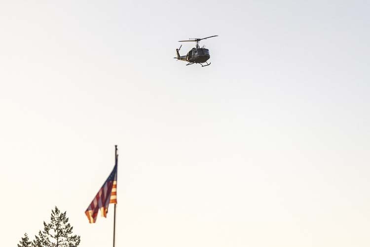 Here’s something you don’t see at many high school football games: A helicopter flyover. Photo by Mike Schultz