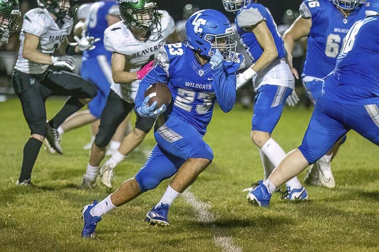 La Center’s Jalen Ward rushed for two touchdowns Friday in a win over Woodland. Photo by Mike Schultz