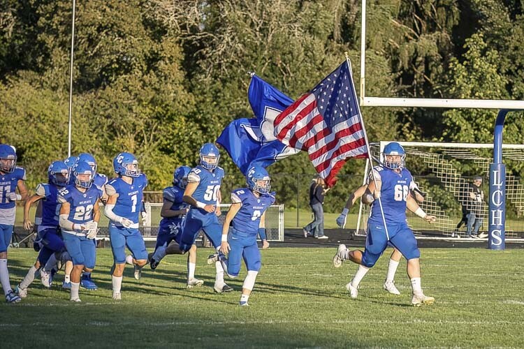 The La Center Wildcats bring their energy to the field prior to their Friday night home game against Woodland. Photo by Mike Schultz