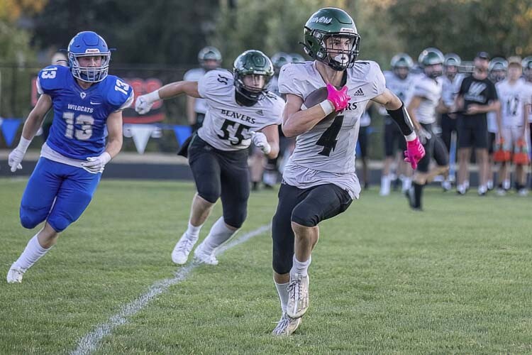 Elijah Andersen of Woodland lined up as a receiver, a running back, and quarterback at times for the Beavers on Friday night. Photo by Mike Schultz
