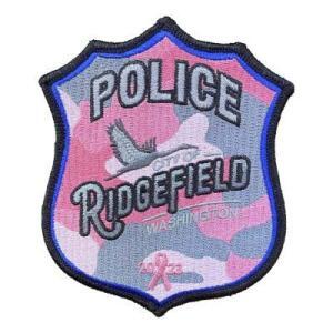This year, Ridgefield is expanding the awareness campaign beyond uniform patches. Ridgefield police vehicles will feature pink ribbons for the month of October, and city staff are participating by wearing pink city logo shirts on Wednesdays. Photo courtesy city of Ridgefield