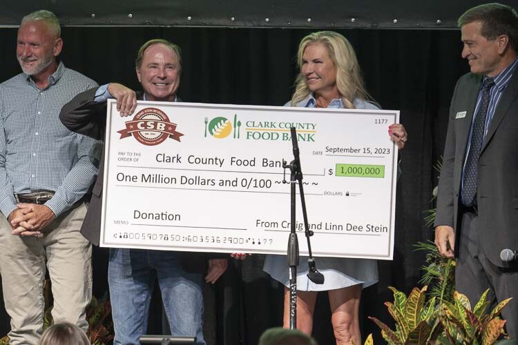 Pictured here is Craig and Linn Dee Stein (middle) flanked by Clark County Food Bank President Alan Hamilton (right) and Board Member Byron Van Kley (left). Photo courtesy Clark County Food Bank
