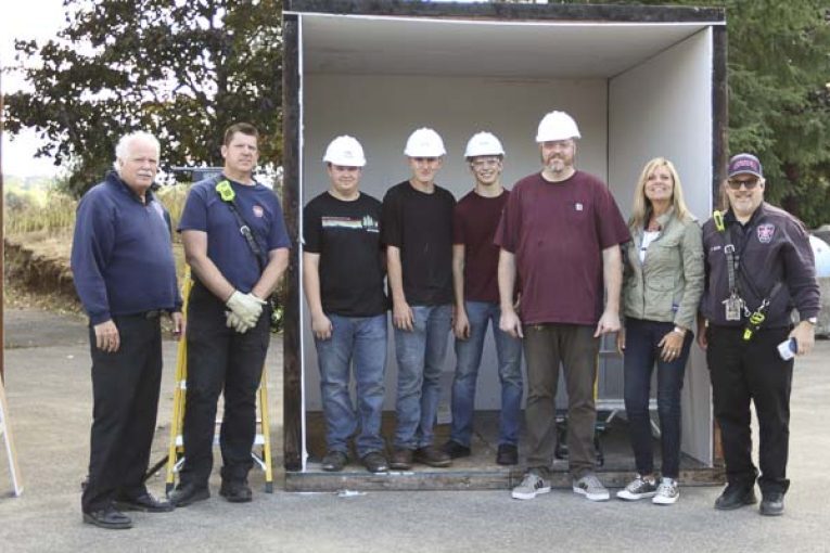 Washougal High School students construct prop rooms for fire department safety open house