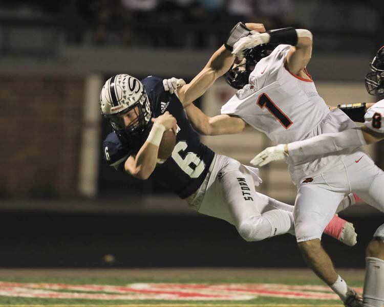 Skyview quarterback Jake Kennedy dives for some extra yardage after a long run early in Friday’s win over Battle Ground. Kennedy threw three TD passes and ran for another in a 49-10 win. Photo courtesy Chris Barker