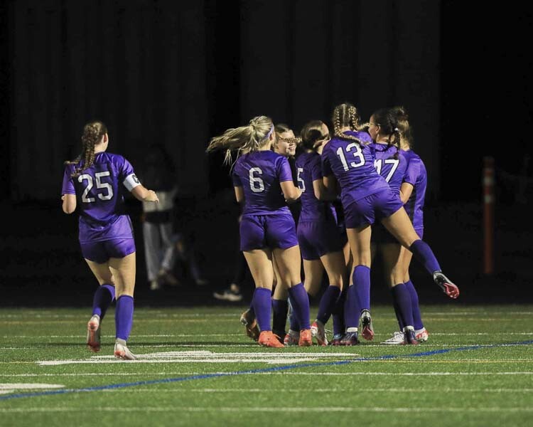 The Rapids celebrate around Avah Eslinger after her second half goal that propelled Columbia River to a 1-0 win over Ridgefield Tuesday. Photo courtesy Chris Barker