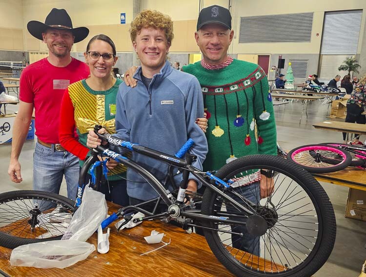 Oregonians Nate Friese, Annalisha Cox, Bennett Wellman, and Brian Wellman made their way to Clark County on Saturday morning to volunteer for the Bike Build. Photo by Paul Valencia