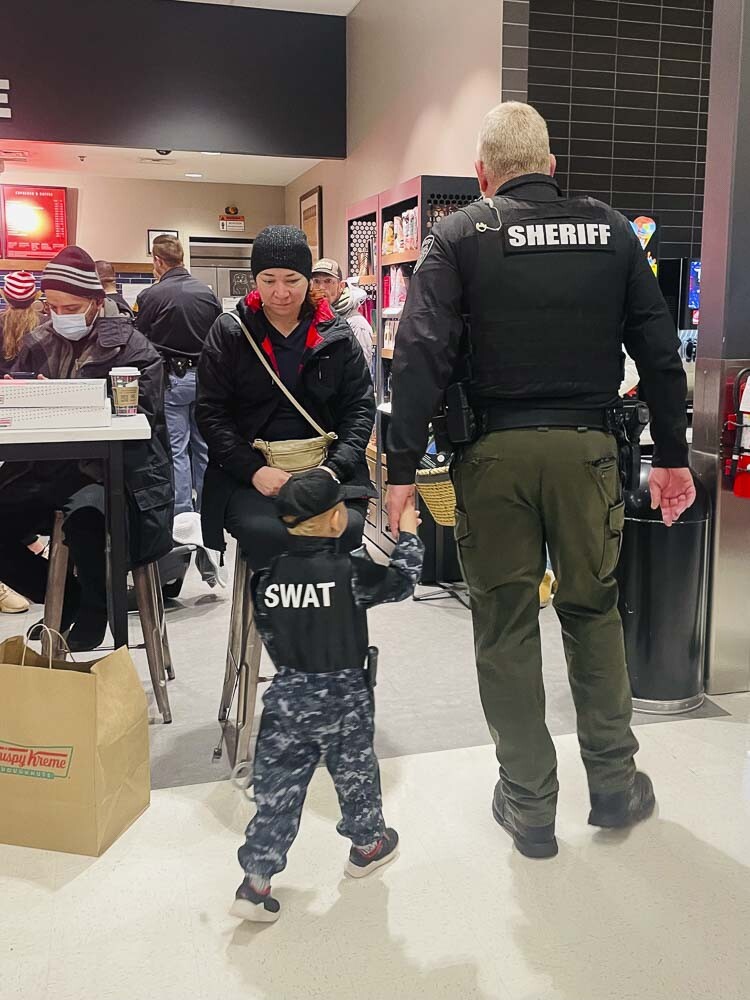 A Clark County Sheriff’s Office deputy and his “mini me’’ are shown at Saturday’s Shop With a Cop event. Photo courtesy Leah Anaya