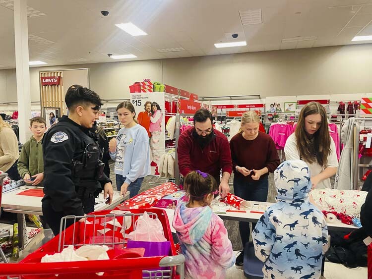 Volunteers from King’s Way Christian School were on hand to wrap the gifts the young shoppers selected for family members. Photo courtesy Leah Anaya