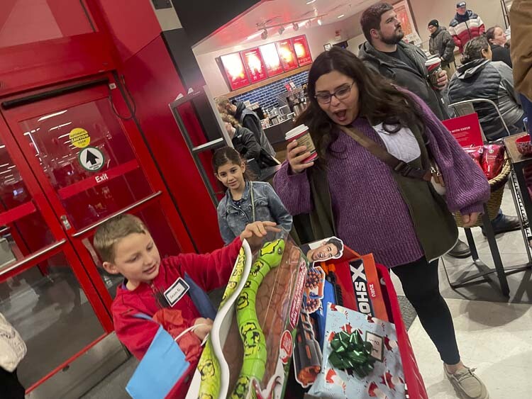 Mom Natalya Guzman reacts to the results of her children’s shopping trip Saturday. Photo courtesy Leah Anaya