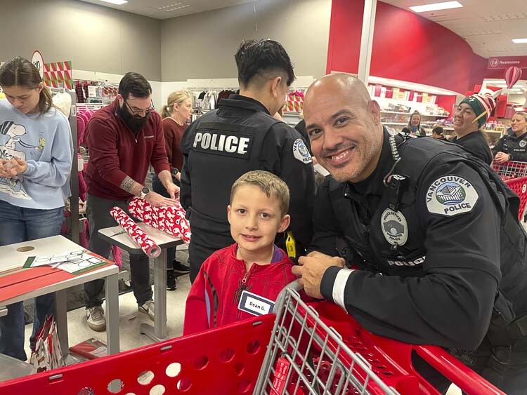 Officer Jeff Anaya is shown here with his shopper Dean. Photo courtesy Leah Anaya