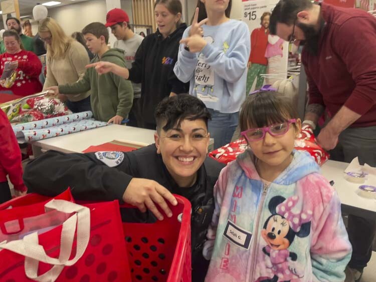 Officer Nicole Vigil is shown here with Selah at Saturday’s Sop With a Cop event. Photo courtesy Leah Anaya