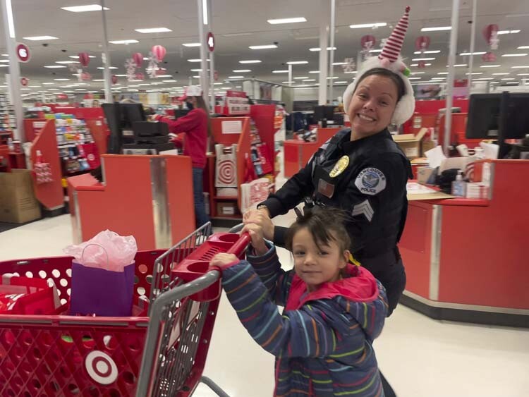 Officer Danielle Wass is shown here with her shopper. Photo courtesy Leah Anaya