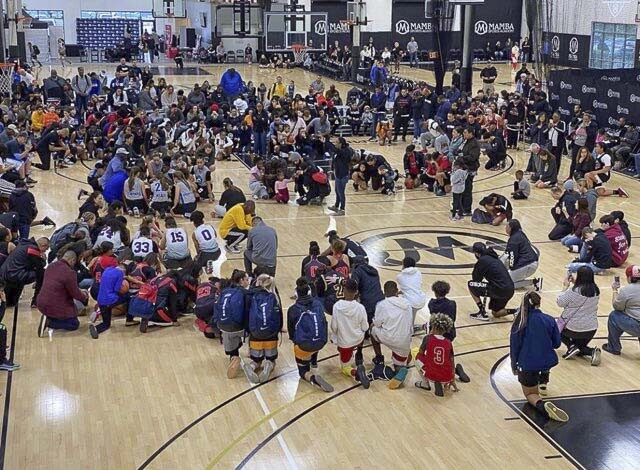 When news spread at what was then called the Mamba Sports Academy, all games in the youth basketball tournament were stopped, and players, coaches, and families gathered in prayer. Photo courtesy Smith family