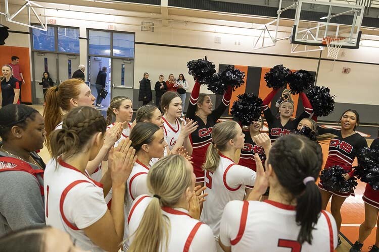 The Camas girls basketball team celebrates its win Saturday in the state regionals. The No. 1 seed in Class 4A Washington, the Papermakers will play Thursday in the quarterfinals in Tacoma. Photo by Mike Schultz