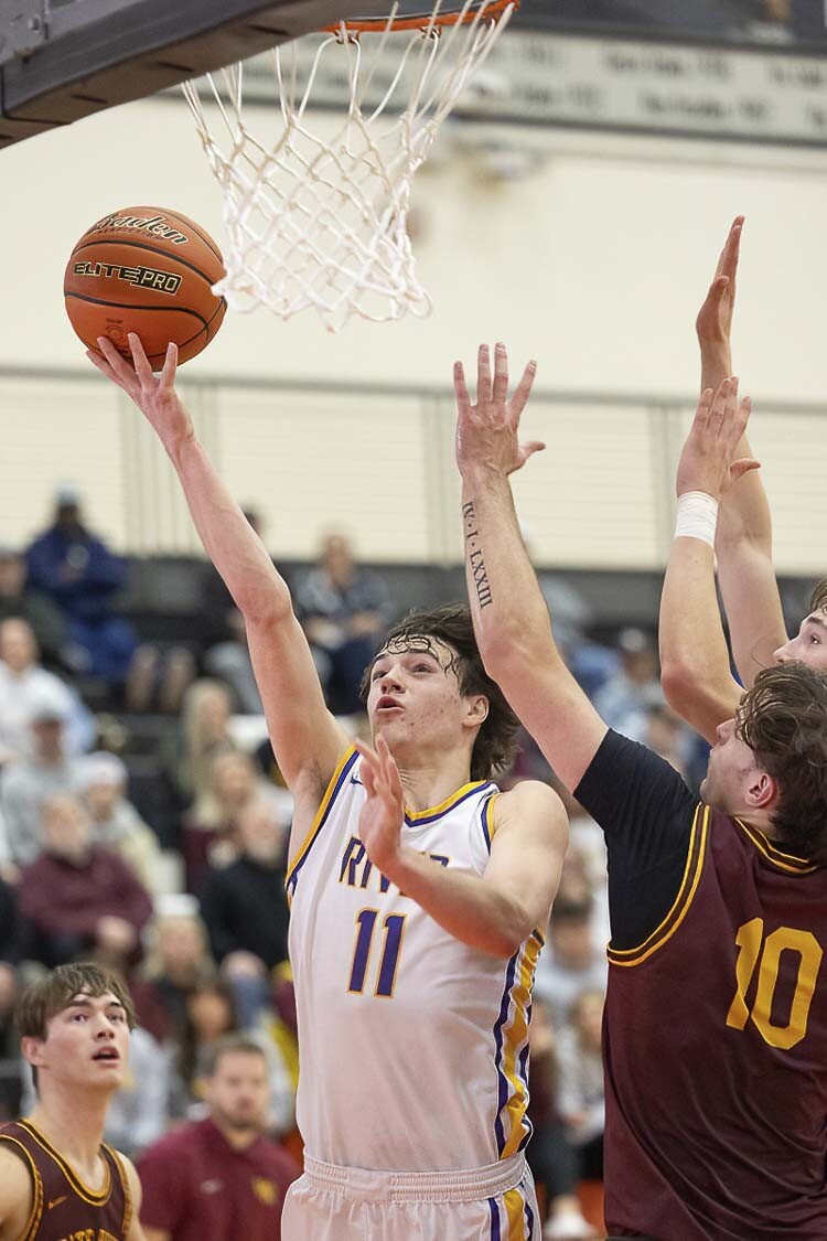 Columbia River’s John Reeder goes up for a score last week in the state regionals. The Rapids are in the Class 2A state round of 12 in Yakima on Wednesday. Photo by Mike Schultz