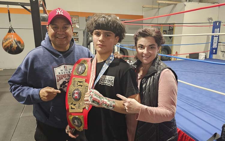 Cain and Angi Elizondo make a great team, helping their son Cain Elizondo Jr. become the best he can be in boxing and in life. God and family come first, then boxing. Junior is the top-ranked boxer in the country in his age group. Photo by Paul Valencia