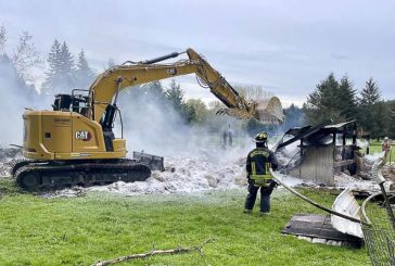 Vancouver Fire utilizes heavy equipment to extinguish barn fire