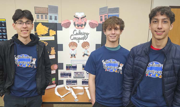 Luke Twiss, Isaac Miller, and Sebastian Najar, three seniors from Evergreen High School, created Culinary Conquest, a video game that won the SkillsUSA state competition for video game development. Photo by Paul Valencia