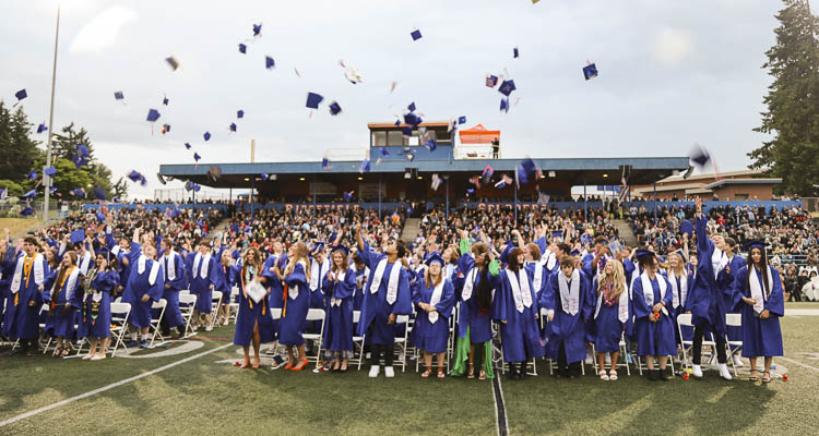 RHS graduates throw their caps in the air at the conclusion of the 2023 Graduation Ceremony. Photo courtesy Ridgefield School District