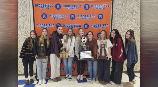 Ridgefield Spudders celebrate their second consecutive Class 2A state title in girls soccer, showcasing teamwork and community pride.