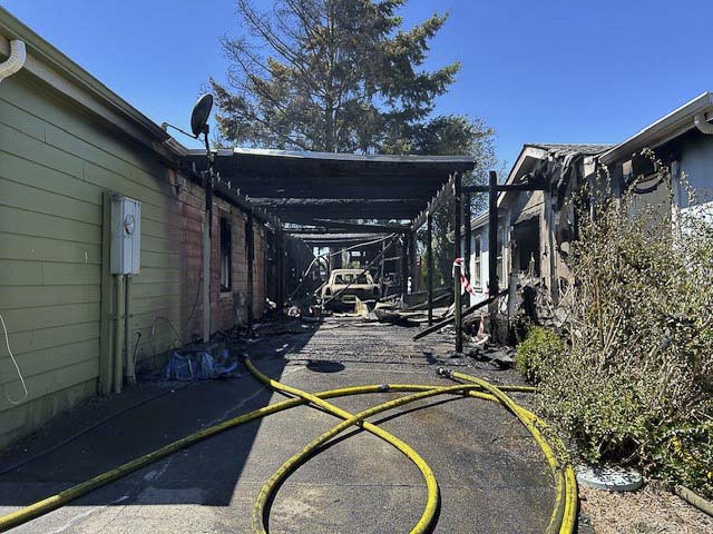 Vancouver Fire crews contained two burning homes and a brush fire in Oak Creek Mobile Home Park; five residents were displaced, no injuries reported.