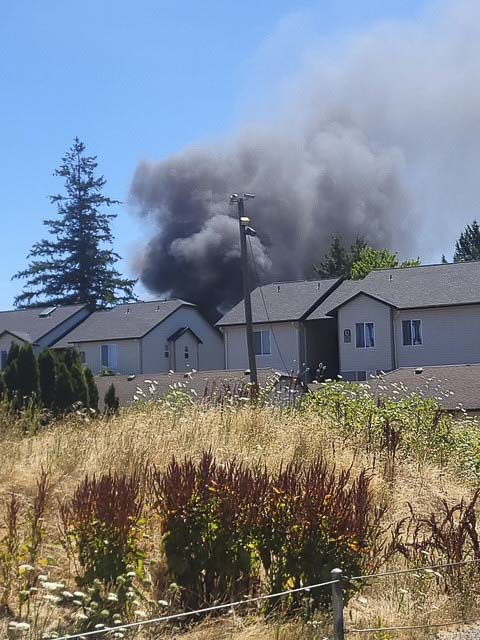Vancouver Fire crews contained two burning homes and a brush fire in Oak Creek Mobile Home Park; five residents were displaced, no injuries reported.