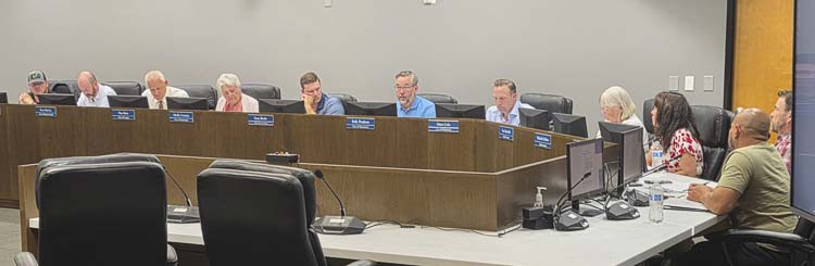 The 11 members of the Board Composition Review Committee discuss changes to the C-TRAN Board of Directors at a special meeting Tuesday. Photo by Paul Valencia