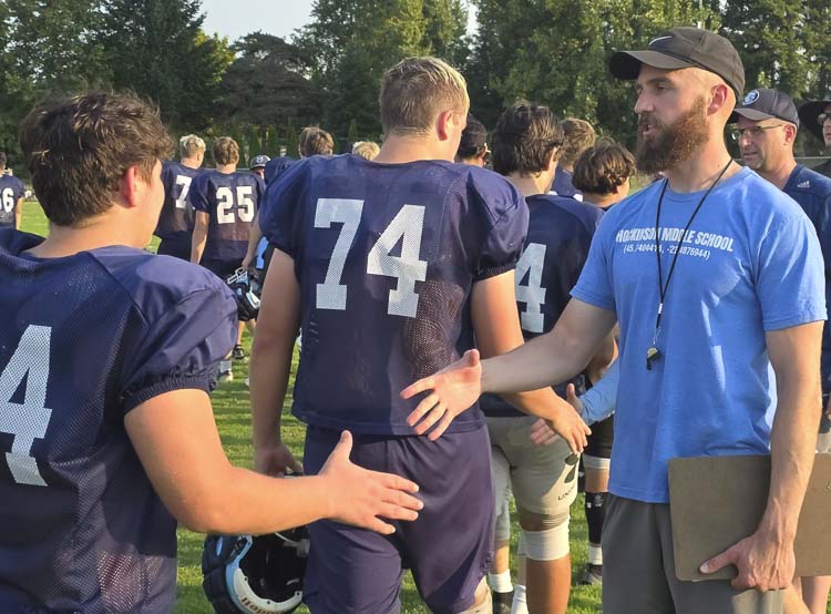 Ben Nelson, the new head coach for Hockinson football, shook hands with every player on the team after a recent practice. Nelson said there is a renewed emphasis on a commitment to practice, which will lead to more success for the program. Photo by Paul Valencia