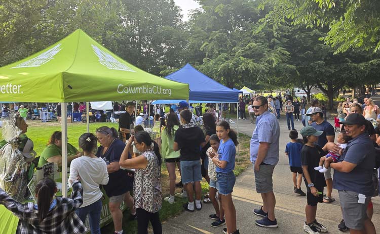 It was so busy Tuesday night that folks had to use overflow parking at LeRoy Haagen Memorial Park for this National Night Out party. Photo by Paul Valencia
