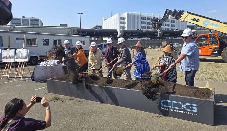City leaders, tribal leaders, and developers took turns turning dirt in a groundbreaking ceremony for what will become a six-story building that will be home to 95 affordable housing units and more in downtown Vancouver. Photo by Paul Valencia