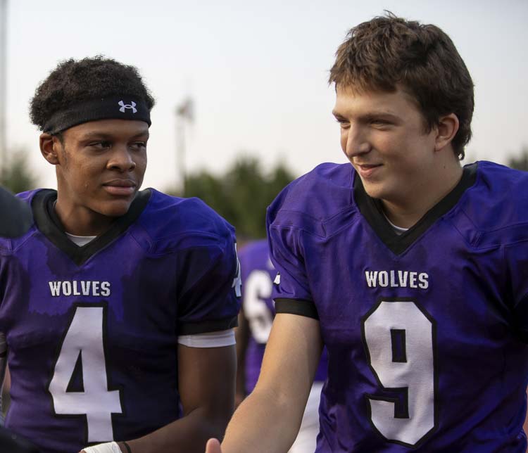 Heritage football captains Dakari Bradford (4) and Owen Daley said the program is really just getting started again. As young players, they endured a horrible losing streak. After the Timberwolves dedicated themselves to the weight room, they have a new belief in the program. Photo courtesy Heather Tianan