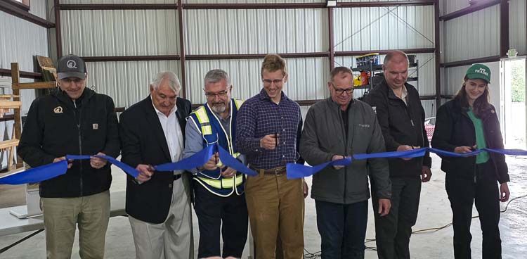Guests cut the ribbon to officially open the Douglas C. Greene Skilled Trades Center at La Center High School on Thursday. Photo by Paul Valencia