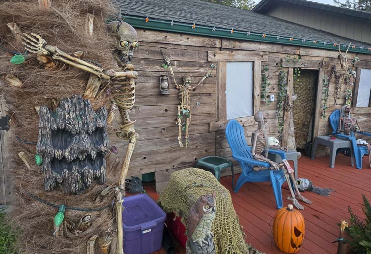 A skeleton climbs a tree at Silver Star Cemetery, the Halloween scare display at Eric Poteete’s house in Vancouver. The Silver Star Cemetery is scarier this year with the return of the false front and more displays. Photo by Paul Valencia