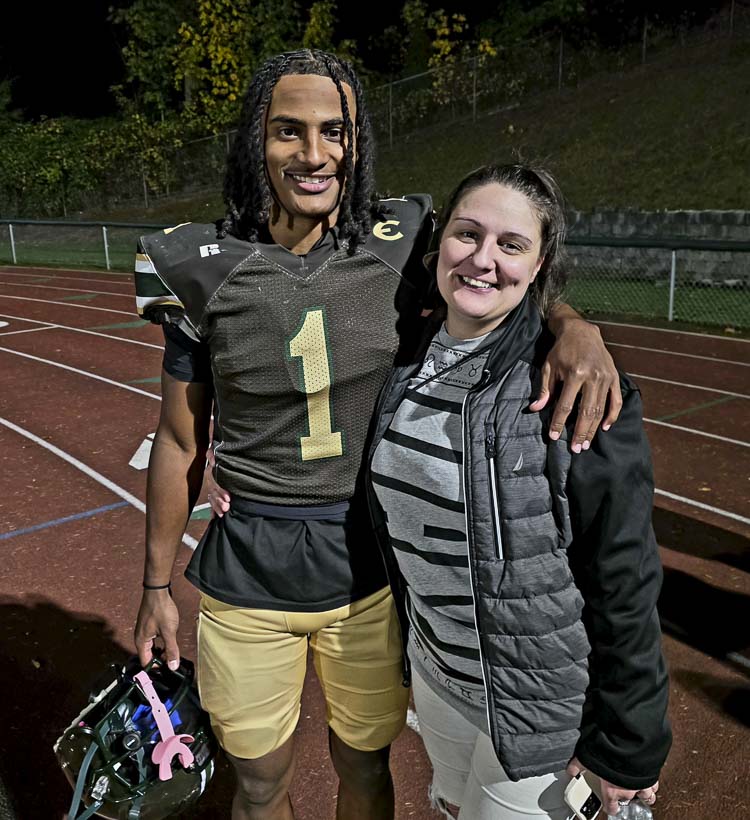 Evergreen’s Terrance Saryon and his mom Olga Kalashnik celebrate after Friday’s win. Saryon said his mother has kept him grounded during a whirlwind of activities, navigating his recruitment. Saryon said he intends to sign with BYU in December. Photo by Paul Valencia